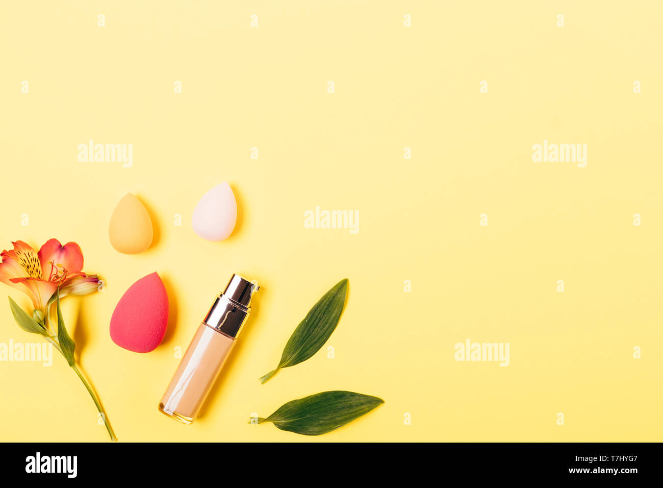 Summer Makeup Background Foundation Cream And Blending Sponges Of Different Sizes On Yellow Table Flat Lay Stock Photo Alamy