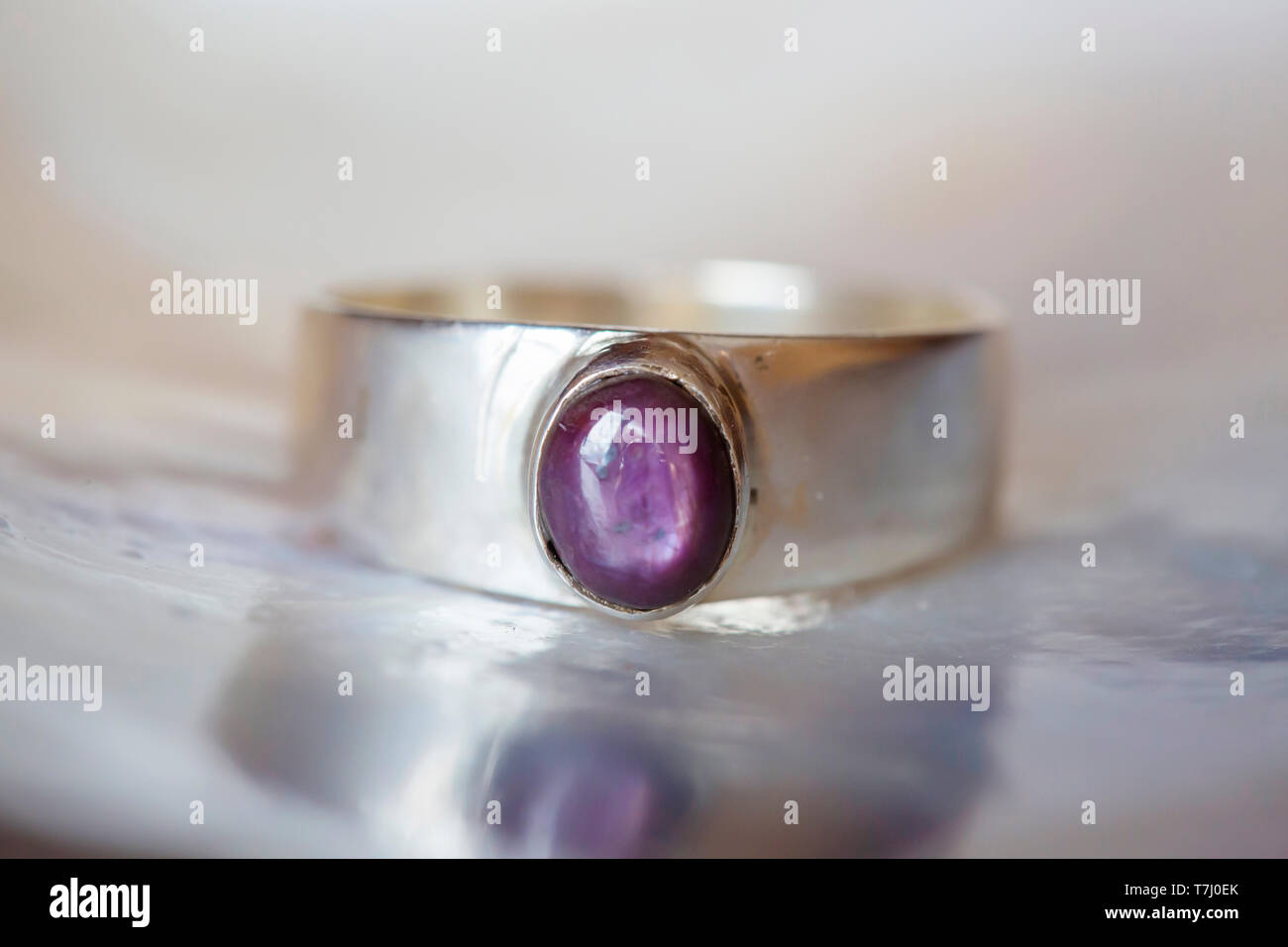 Beautiful silver ring with natural ruby star gemstone Stock Photo