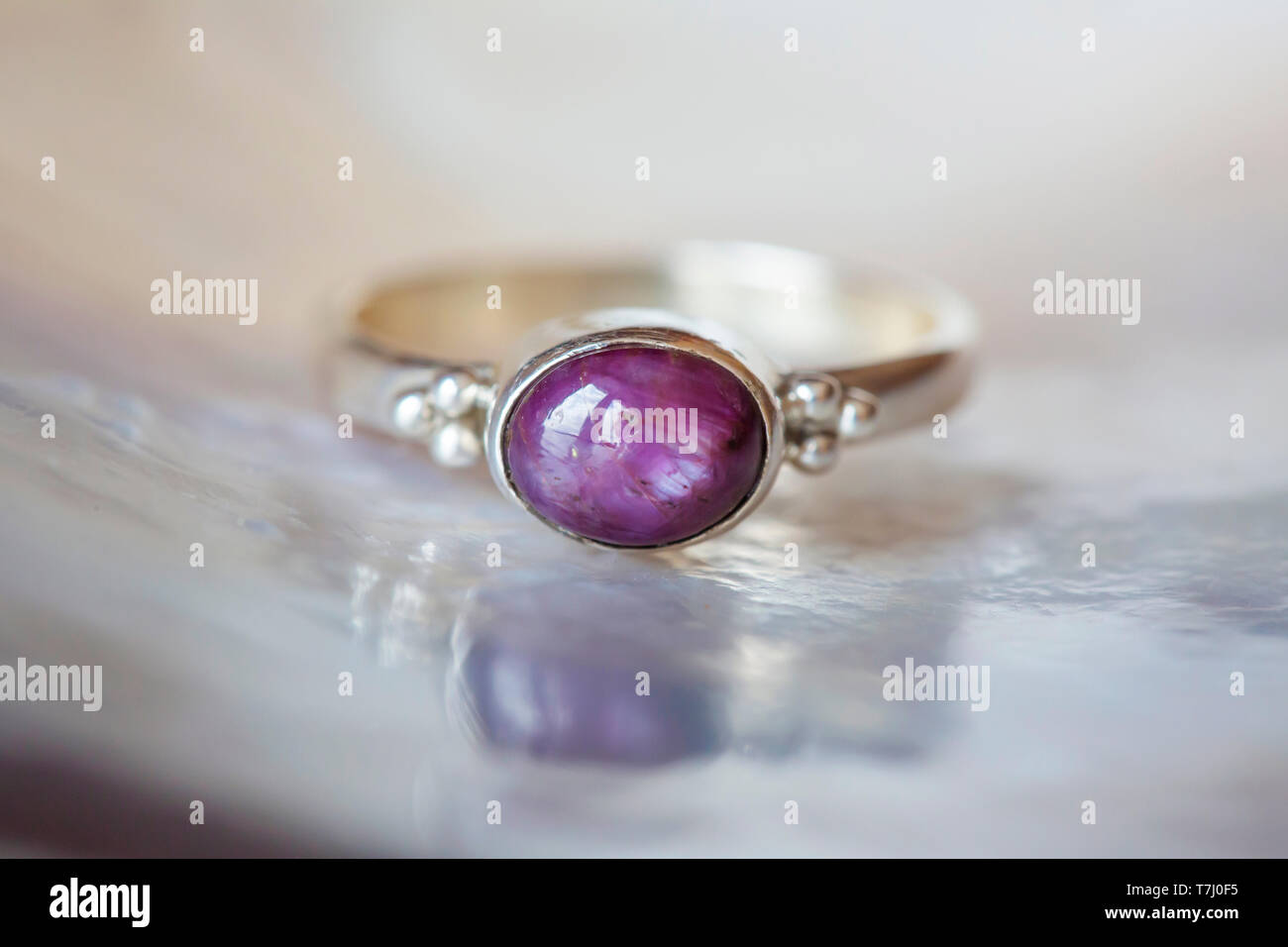Beautiful silver ring with natural ruby star gemstone Stock Photo