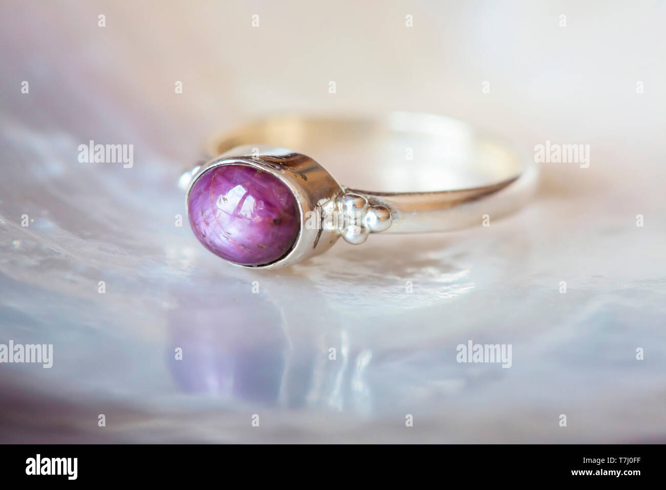Beautiful silver ring with natural ruby star gemstone Stock Photo