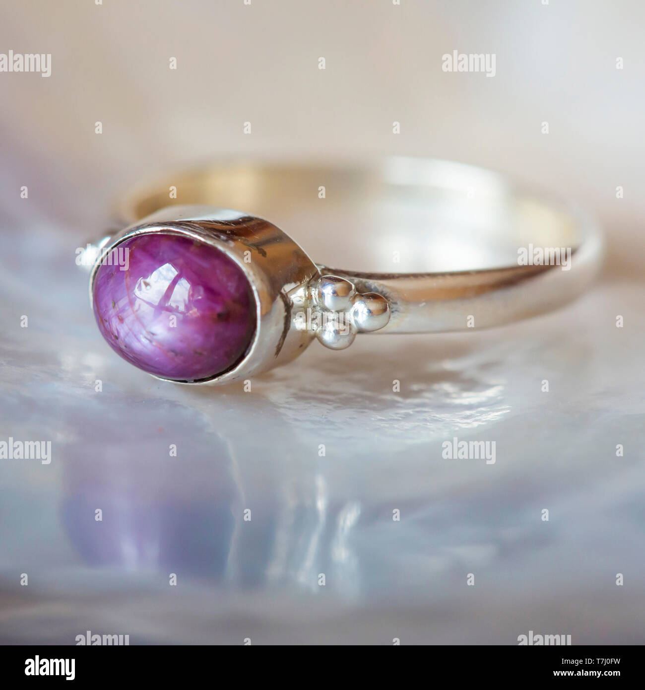 Beautiful silver ring with natural ruby star gemstone Stock Photo