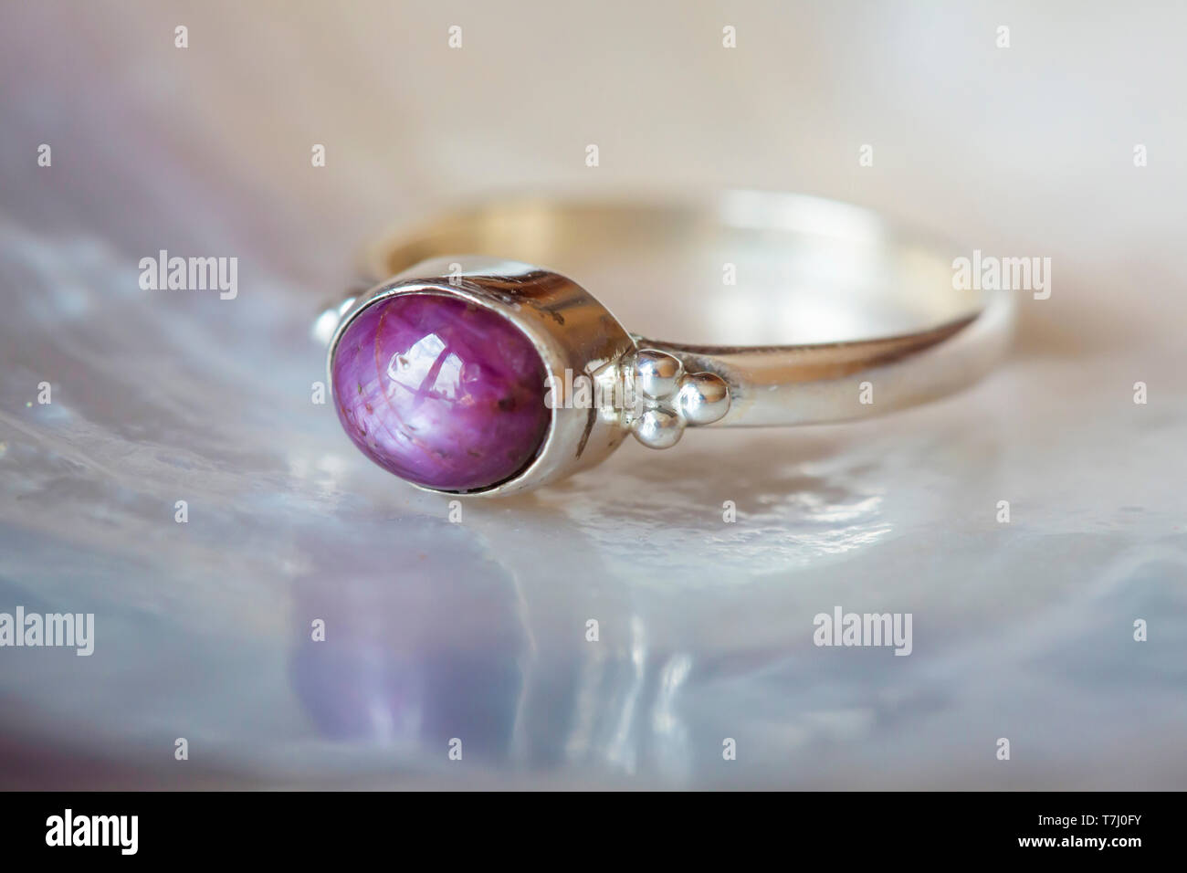 Beautiful silver ring with natural ruby star gemstone Stock Photo