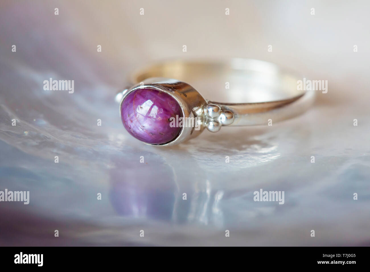 Beautiful silver ring with natural ruby star gemstone Stock Photo
