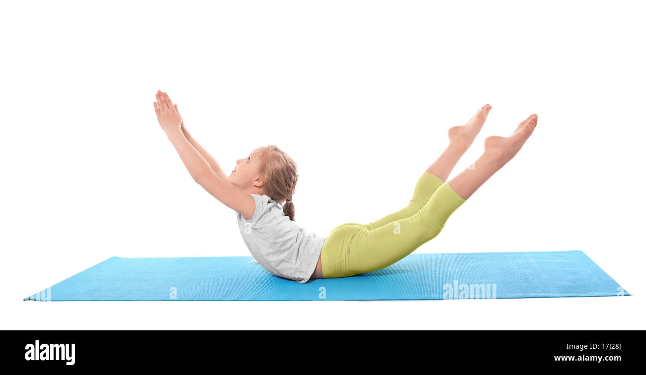 Little girl practicing yoga on white background Stock Photo - Alamy