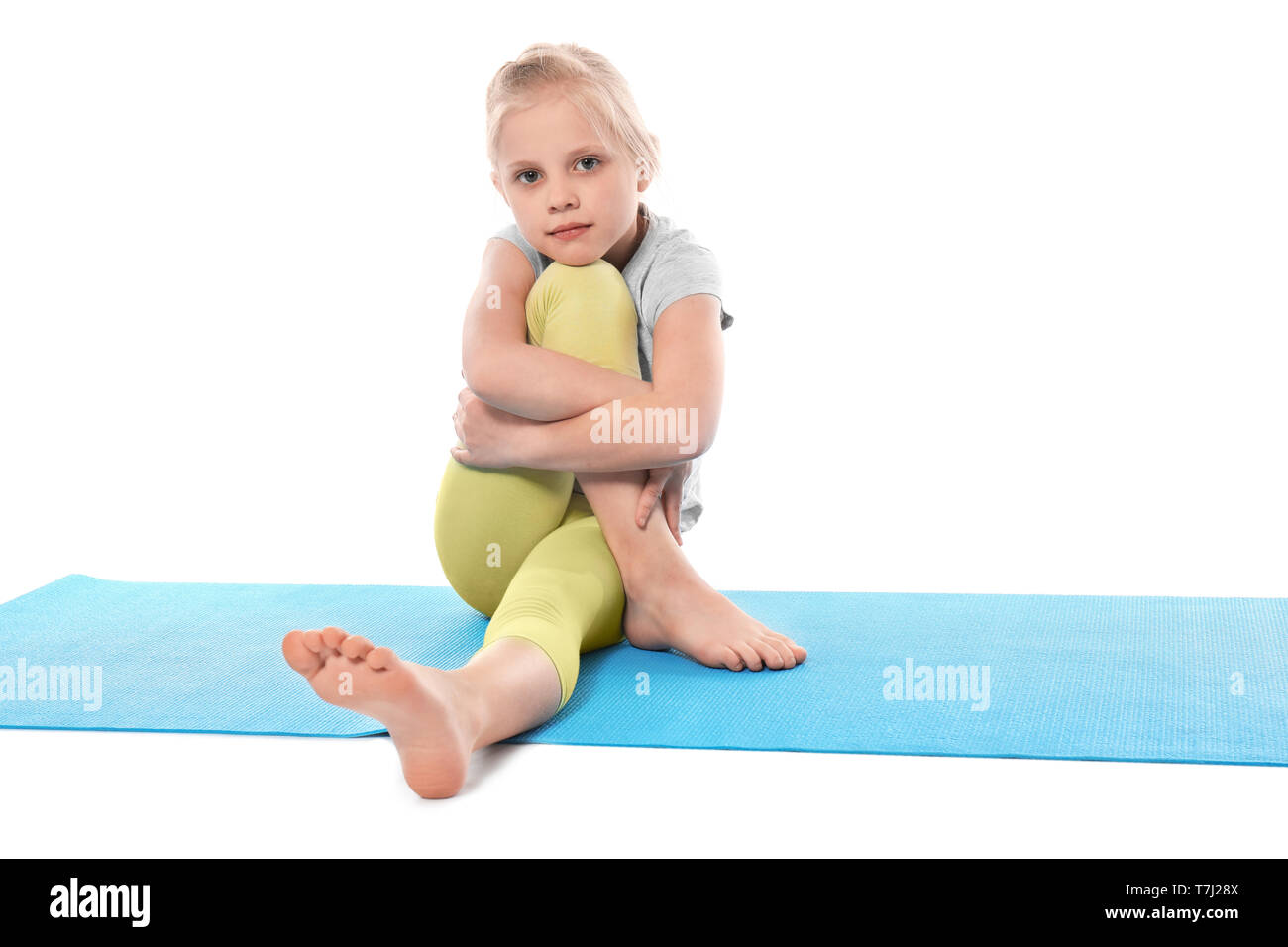 Cute little girl practice yoga Stock Photo - Alamy