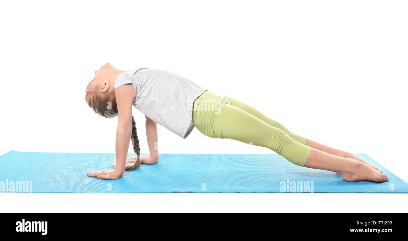 Little girl practicing yoga on white background Stock Photo - Alamy