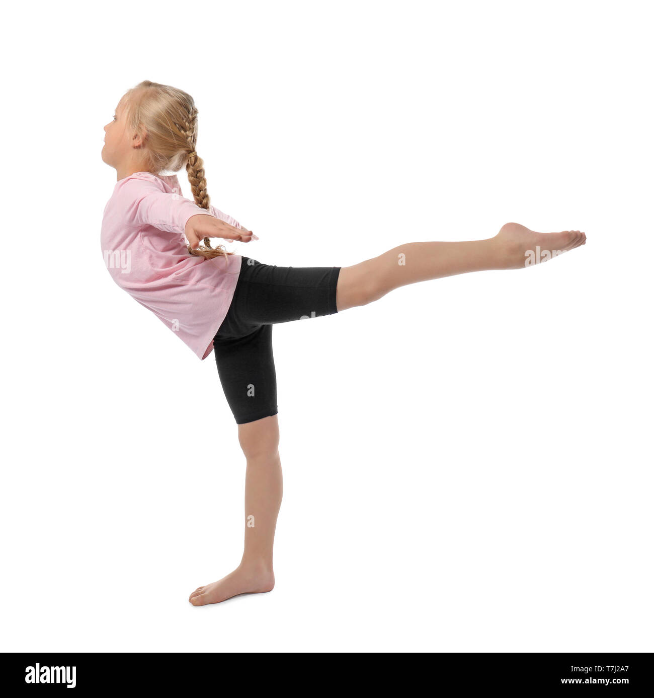 Little girl practicing yoga on white background Stock Photo - Alamy