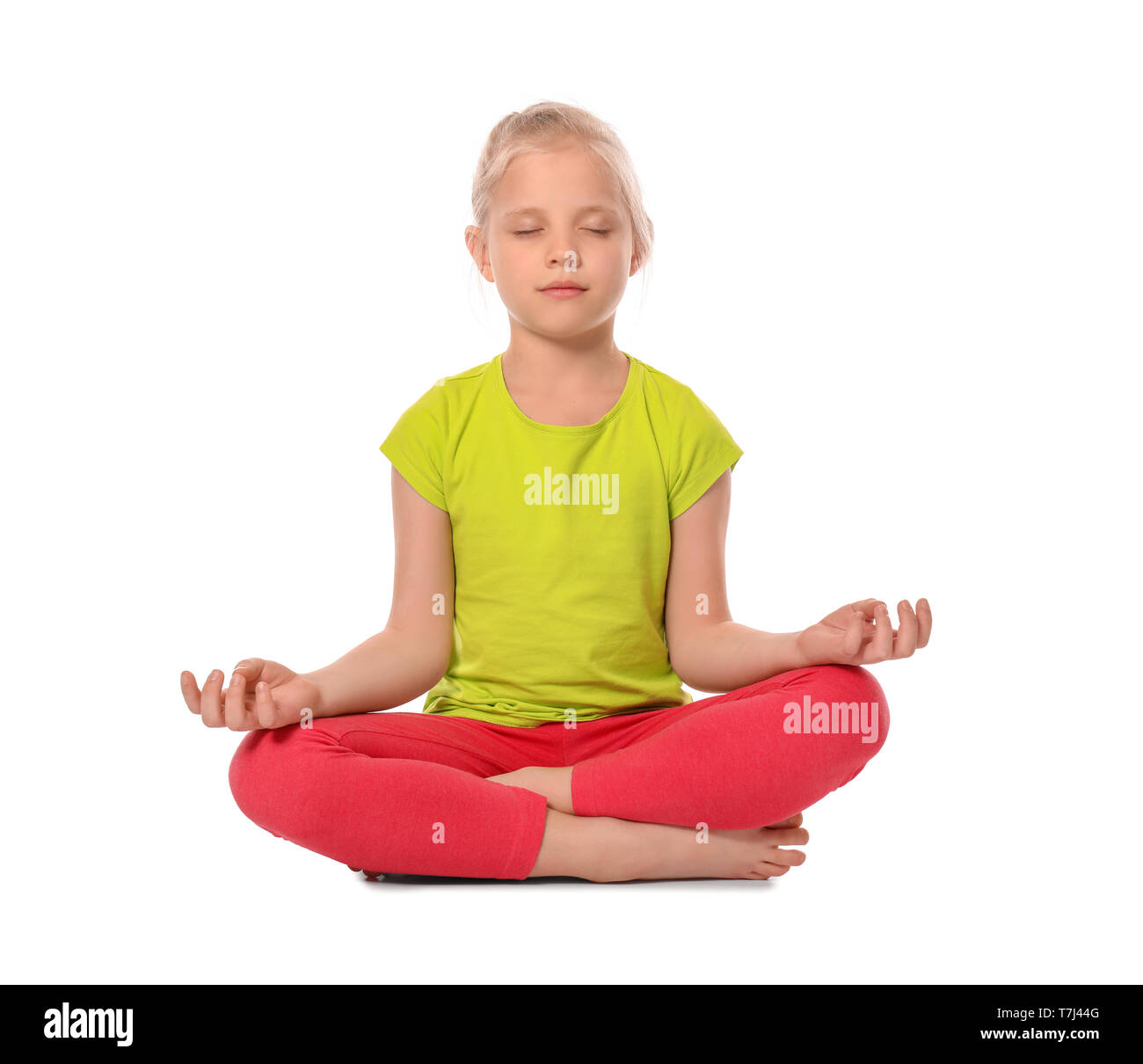 Little girl practicing yoga on white background Stock Photo - Alamy