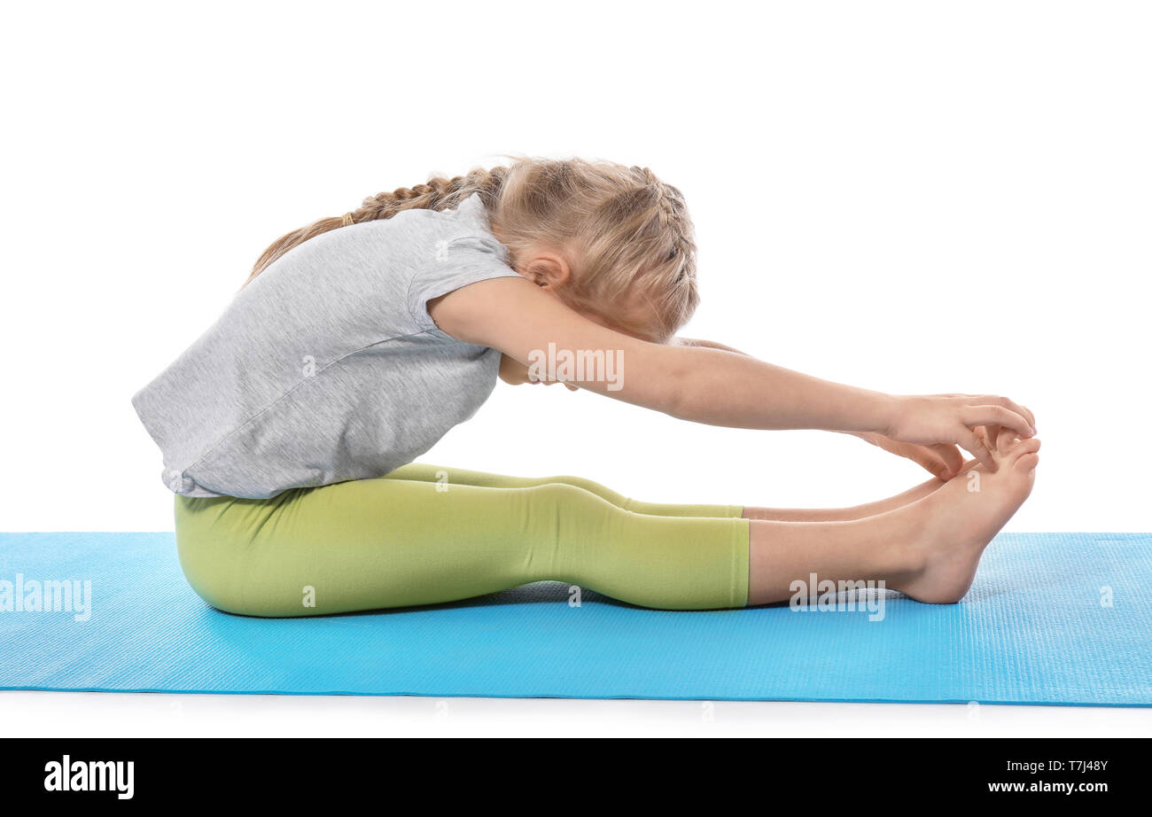 Little girl practicing yoga on white background Stock Photo - Alamy