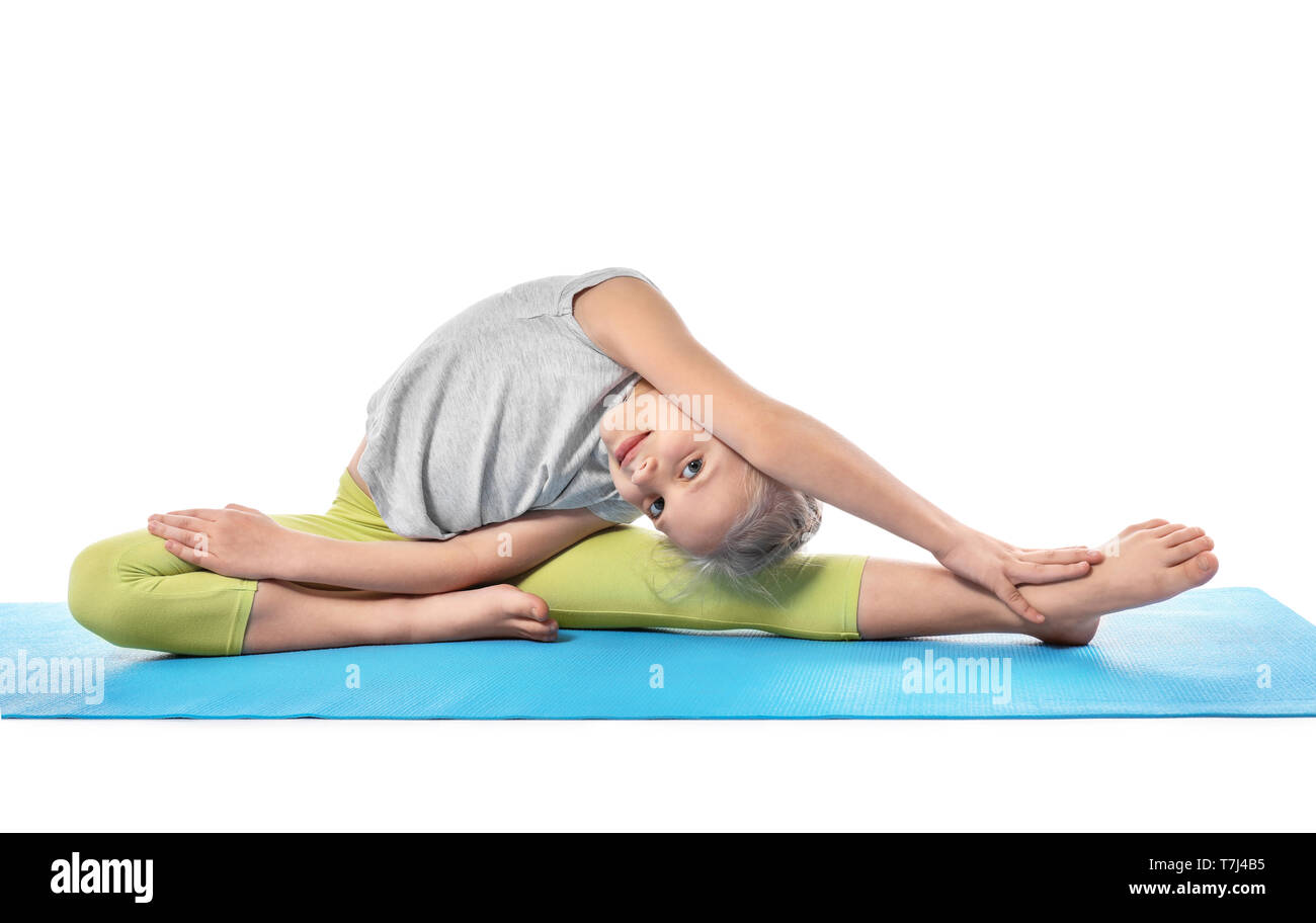 Little girl practicing yoga on white background Stock Photo - Alamy