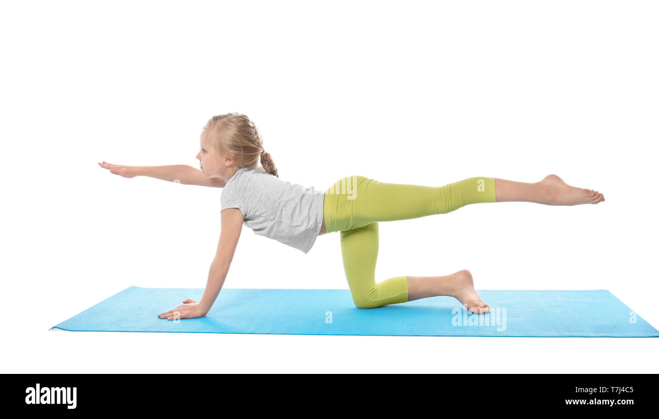 Little girl practicing yoga on white background Stock Photo - Alamy