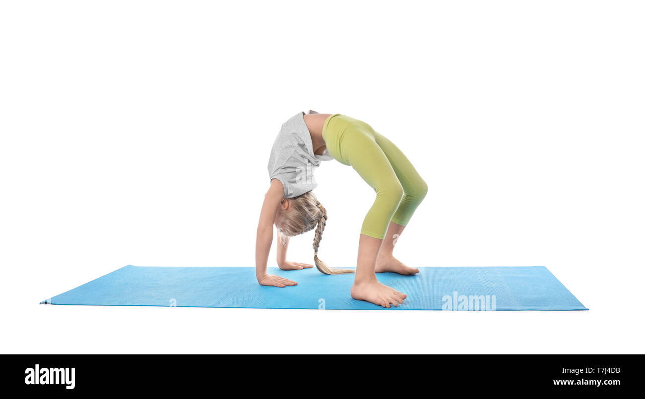 Little girl practicing yoga on white background Stock Photo - Alamy
