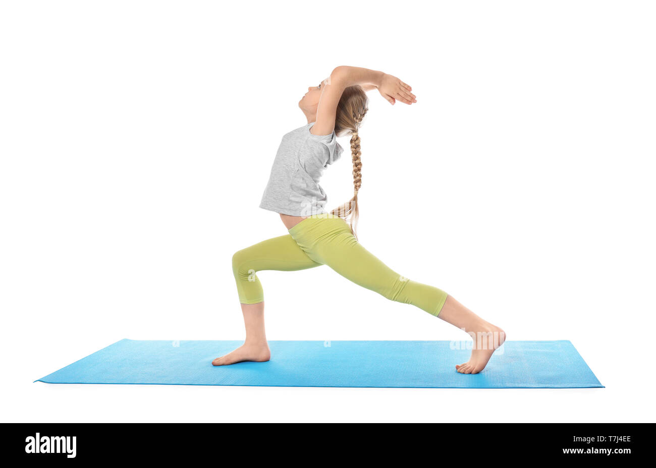 Little girl practicing yoga on white background Stock Photo - Alamy