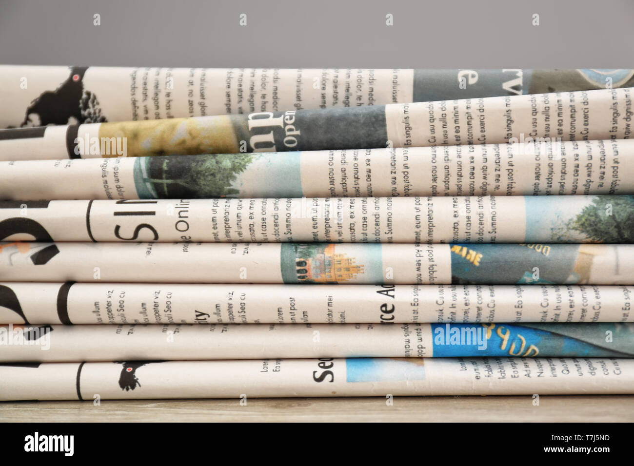 Various newspapers on table, closeup Stock Photo