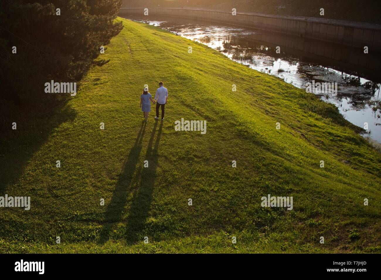 Smart couple walking park hi-res stock photography and images - Alamy