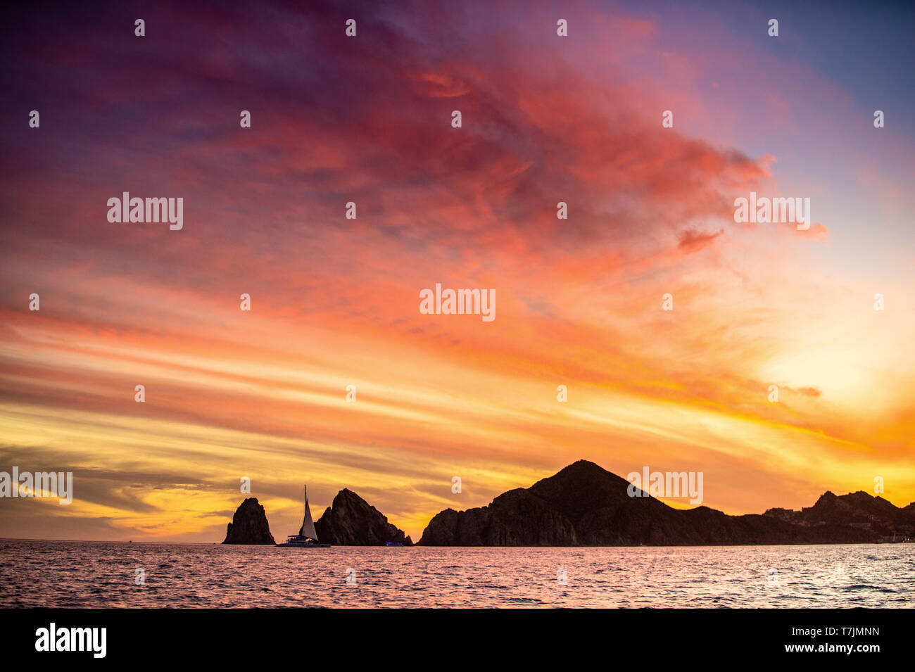 Beautiful Sunset of Seascape with Mountains silhouets. Sea off the Coast of Cabo San Lucas. Gulf of California (also known as the Sea of Cortez, Sea o Stock Photo