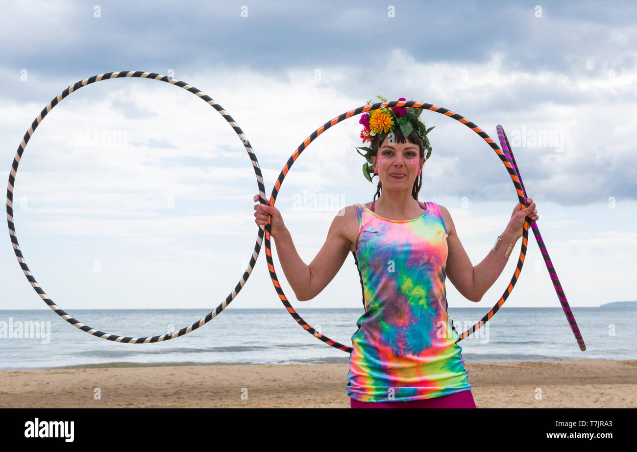 Lottie Lucid with her hula hoops on Boscombe Beach, Bournemouth, Dorset UK in May Stock Photo