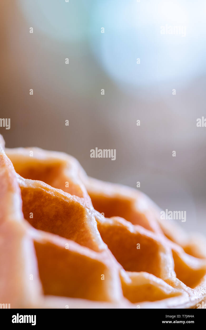 woman hands prepare waffle for serving process.waffle made from dough