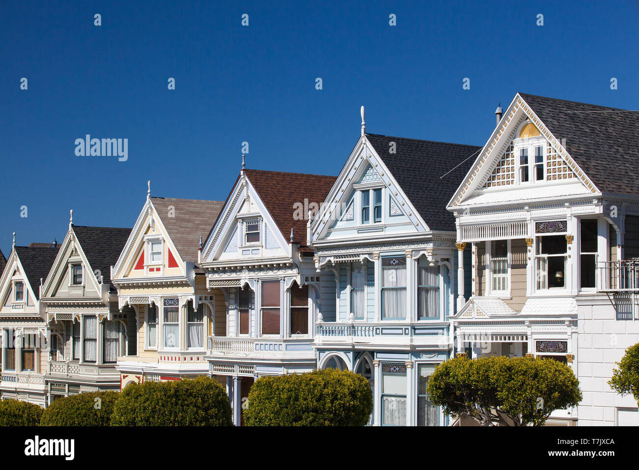 San Francisco, CA,USA - July 20, 2011: Victorian houses in San Francisco with downtown in the background. View from Alamo Square at twilight, San Fran Stock Photo