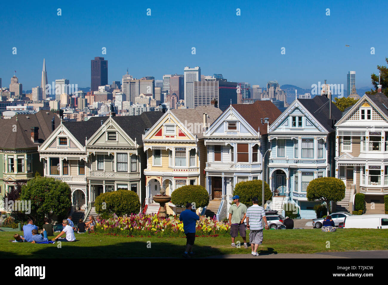 San Francisco, CA,USA - July 20, 2011: Victorian houses in San Francisco with downtown in the background. View from Alamo Square at twilight, San Fran Stock Photo