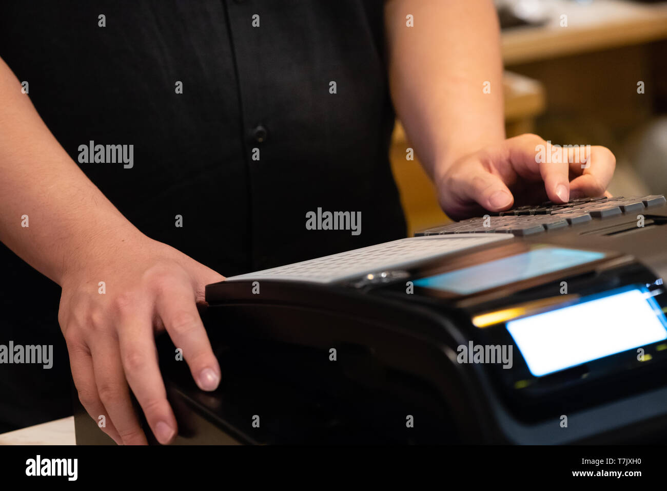 cash register installed on counter for accepting order from customer