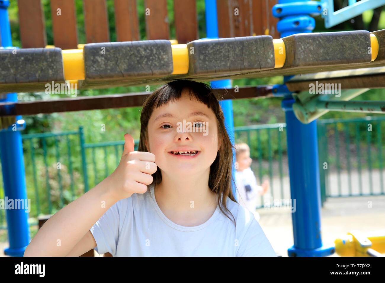 Portrait of little girl smiling in the park Stock Photo - Alamy