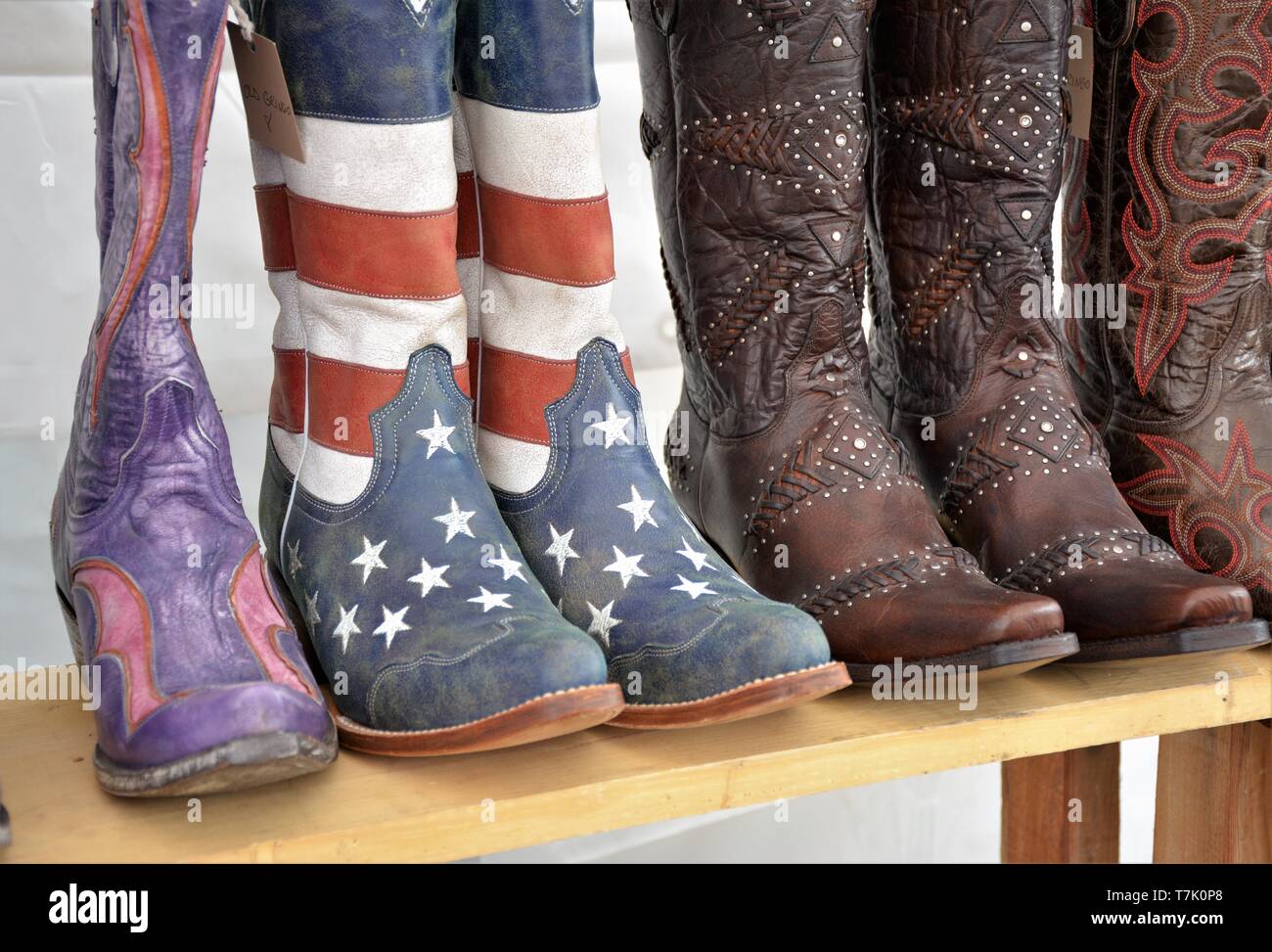 Used cowboy boots with American stars and strips on them for cowgirls in  USA Stock Photo - Alamy