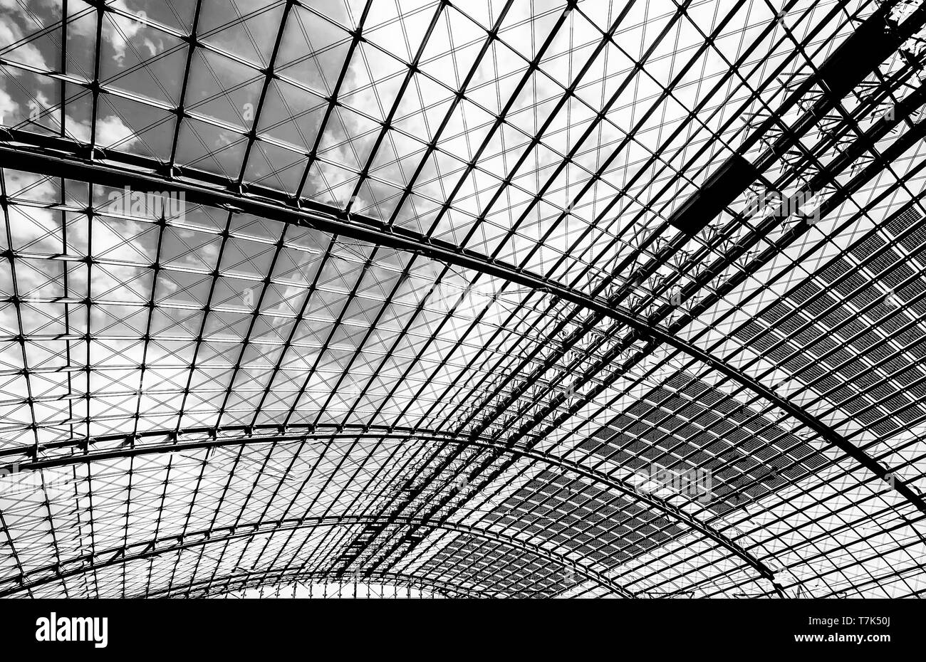 Berlin, Germany, August 18, 2018. Glass ceiling on a sunny day at the central railway station in Berlin uncolored, black and white Stock Photo