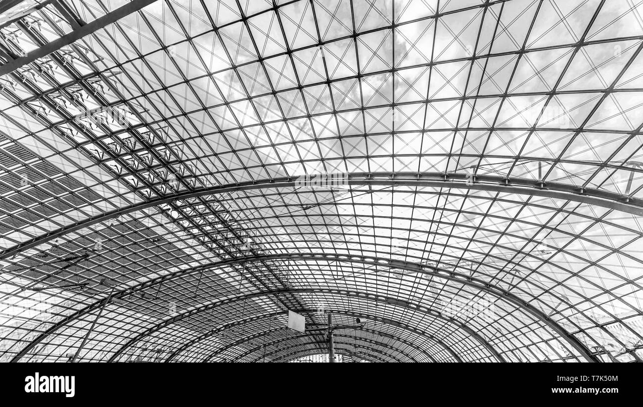 Berlin, Germany, August 18, 2018. Glass ceiling on a sunny day at the central railway station in Berlin uncolored, black and white Stock Photo