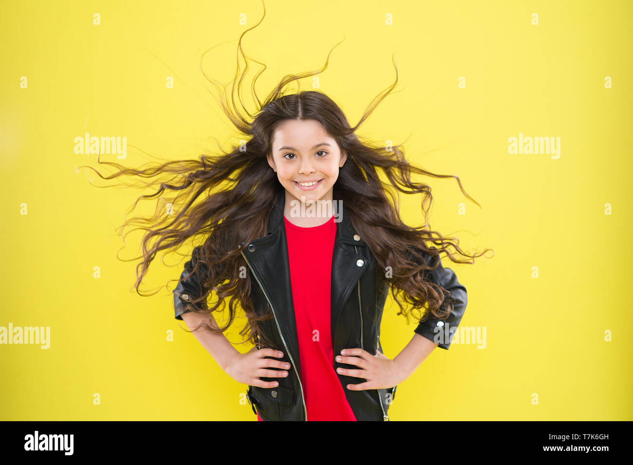 Her hair radiates adorable kid long wavy hairstyle. Wind can also damage hair. Protect hair from wind damage. Strong persistent winds can create tangles and snags in wavy long hair Stock Her hair radiates adorable kid long wavy hairstyle. Wind can also damage hair. Protect hair from wind damage. Strong persistent winds can create tangles and snags in wavy long hair Stock