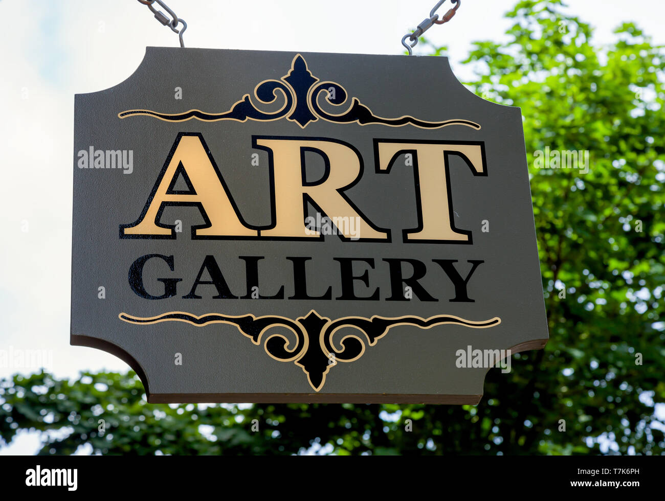 Wooden suspended art gallary sign. Stock Photo