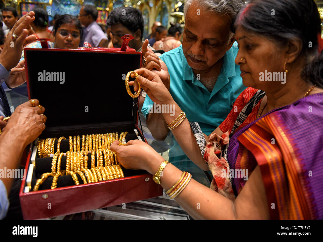 A couple seen purchasing golden ornaments during Akshaya Tritiya festival  day at Kolkata. Akshaya Tritiya is a very popular festival among the Hindus  and Jains. The most popular activity during the festival