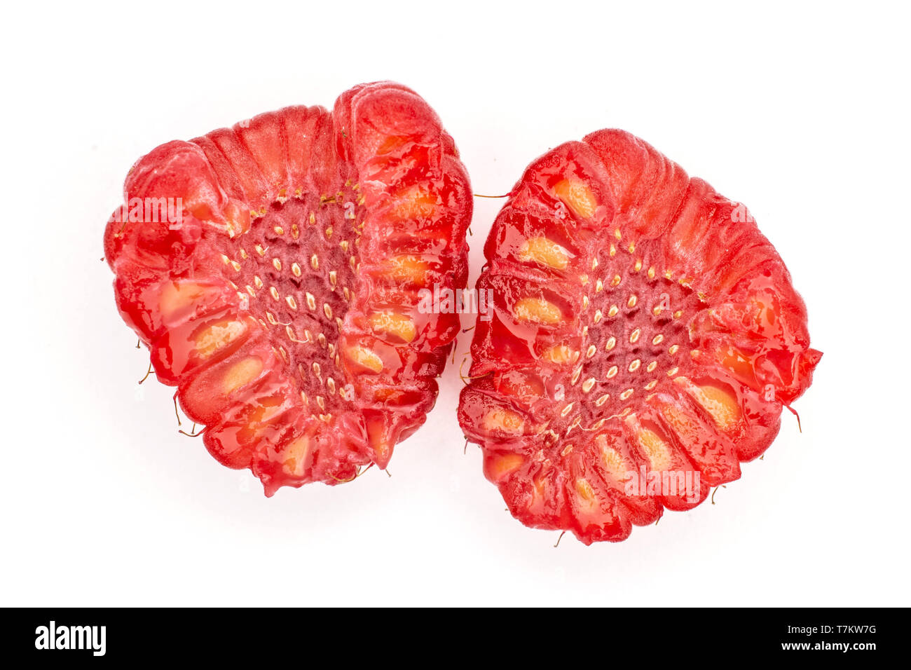 Group of two halves of fresh red raspberry cross section flatlay isolated on white background Stock Photo