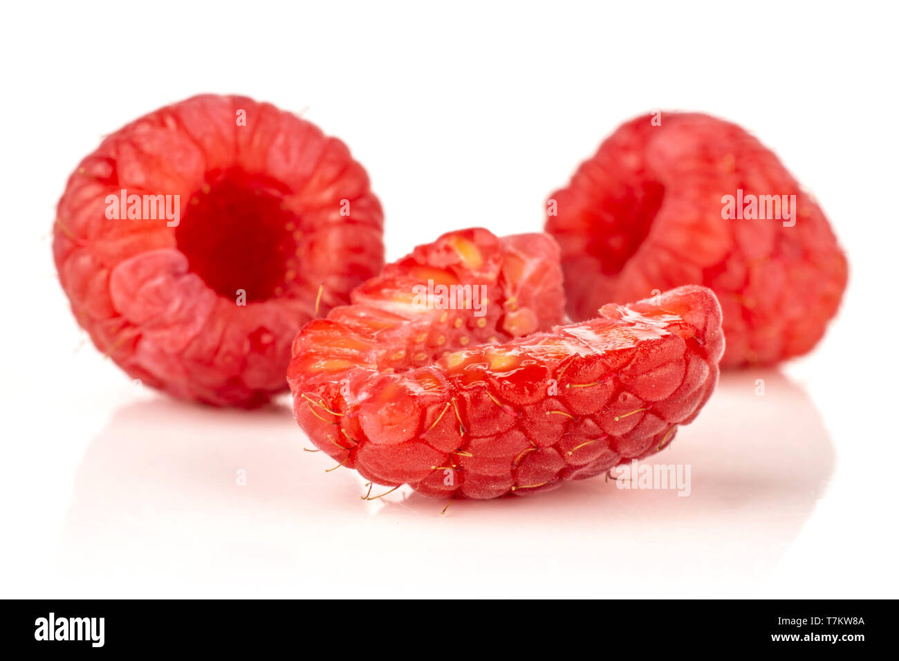 Group of two whole one half of fresh red raspberry isolated on white ...