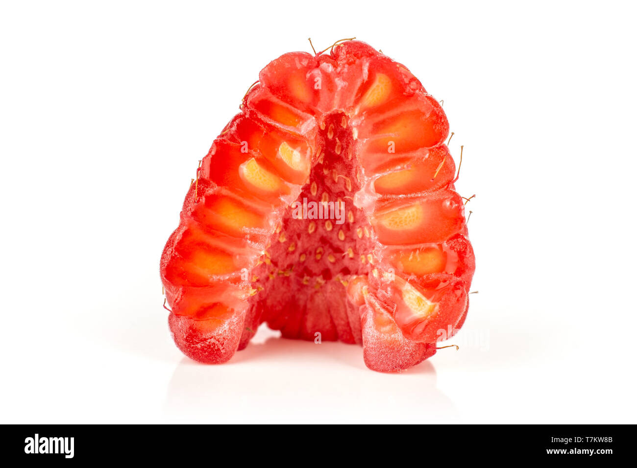 One half of fresh red raspberry cross section isolated on white background Stock Photo
