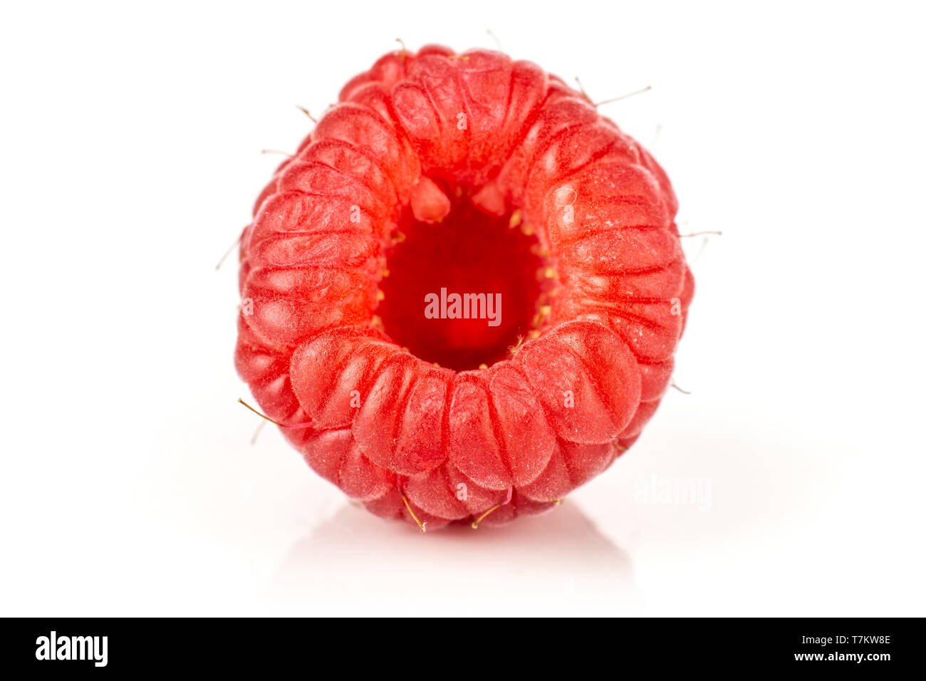 One whole hollow fresh red raspberry isolated on white background Stock ...