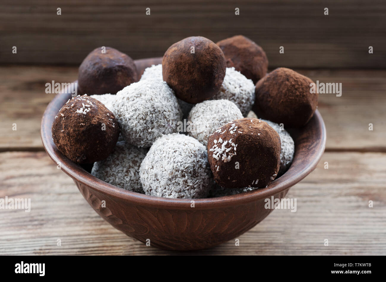 Healthy vegetarian balls with  seeds, almond, walnut and coconut in the brown bowl. Healthy eating concept.Superfood. Stock Photo