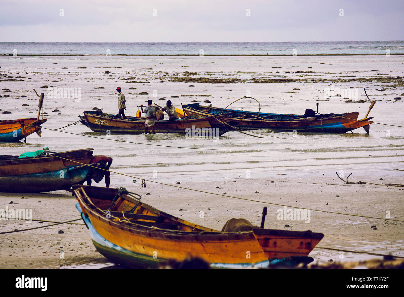 Indian Fishermen On The Beach With Their Boats At Havelock Island