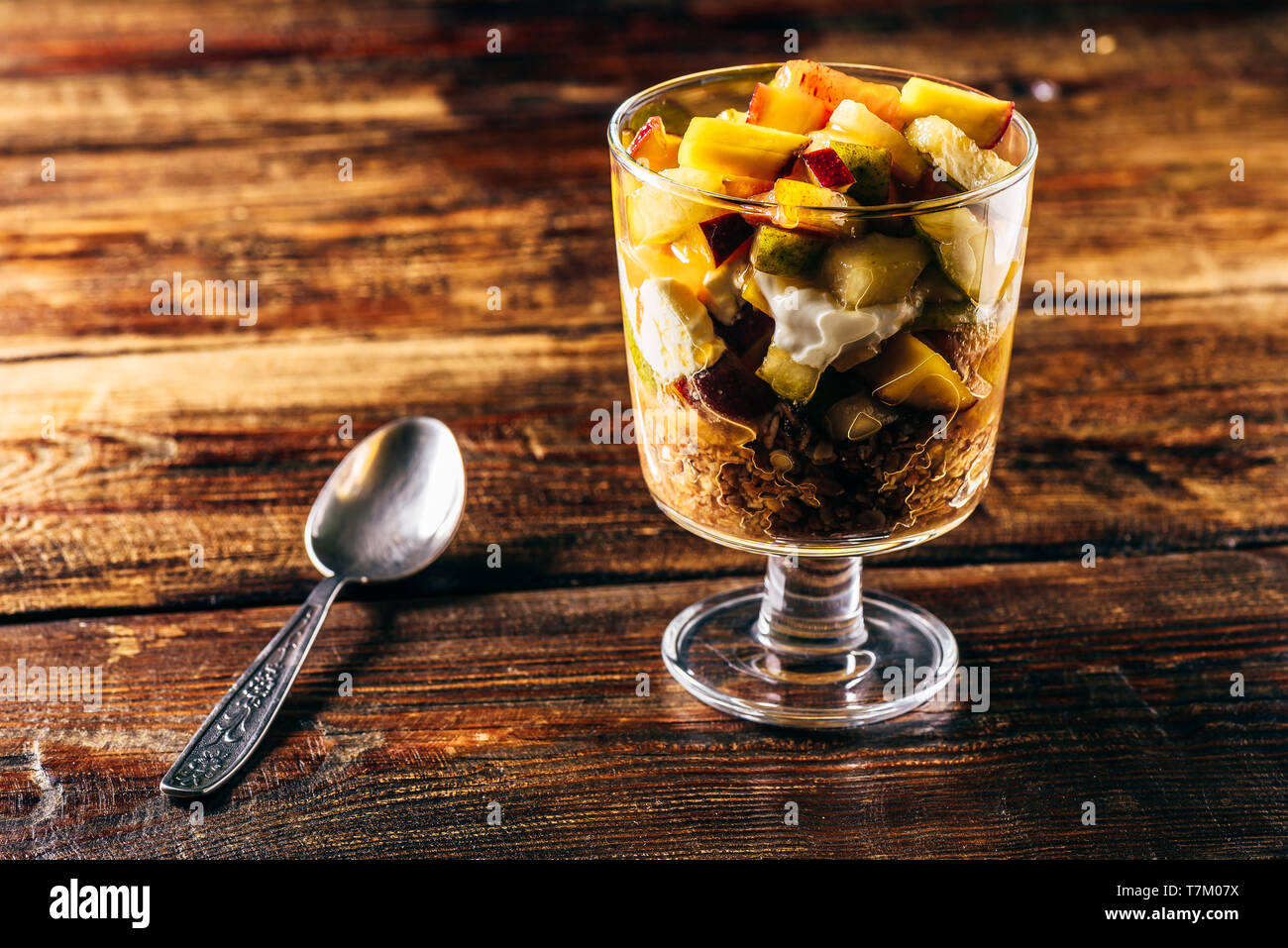 Healthy breakfast of granola, greek yogurt and fruit Stock Photo - Alamy