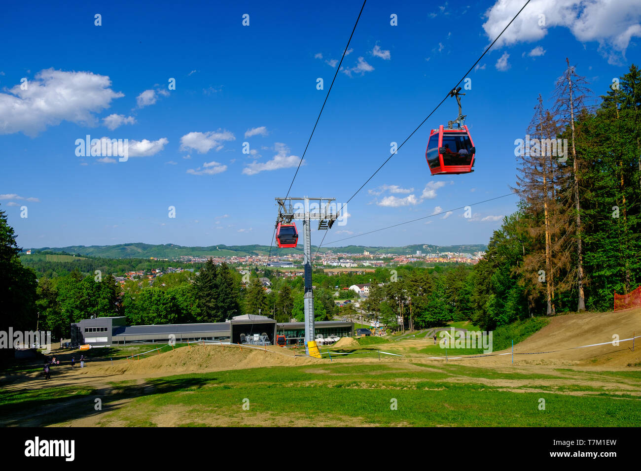 Overhead cable cars at lower station of cableway on Pohorje in Maribor, Slovenia, Mariborsko Pohorje ski slopes are popular hiking destination in Stock Photo