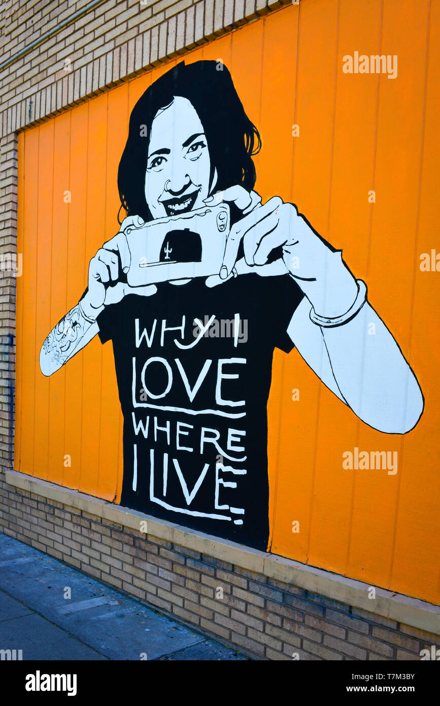 An eye catching orange  mural commissioned by the 'Why I love where I live' brand in the downtown arts district in Tucson, AZ Stock Photo