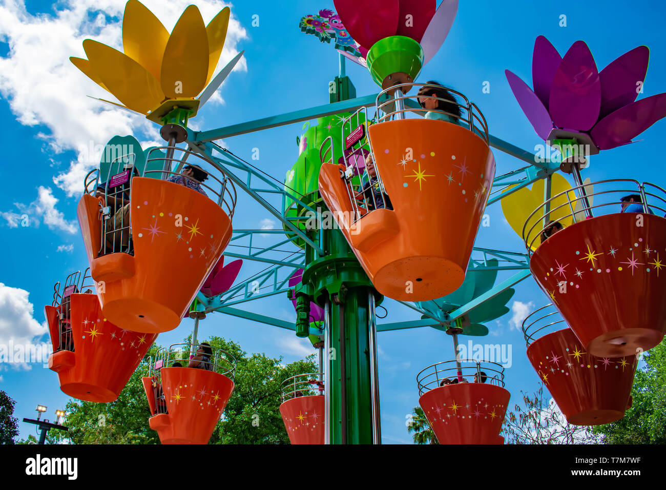 Orlando, Florida. April 7, 2019.Parents and kids enjoying colorful flower pots aboard Abbys