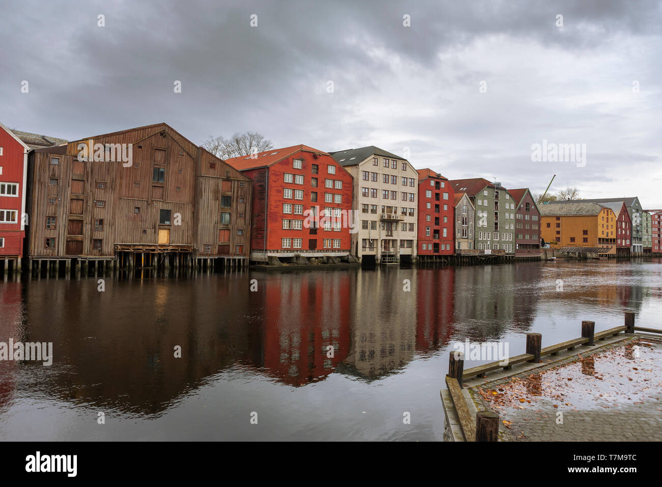 Old warehouses line the Nidelva riverbank, Trondheim, Trøndelag, Norway Stock Photo