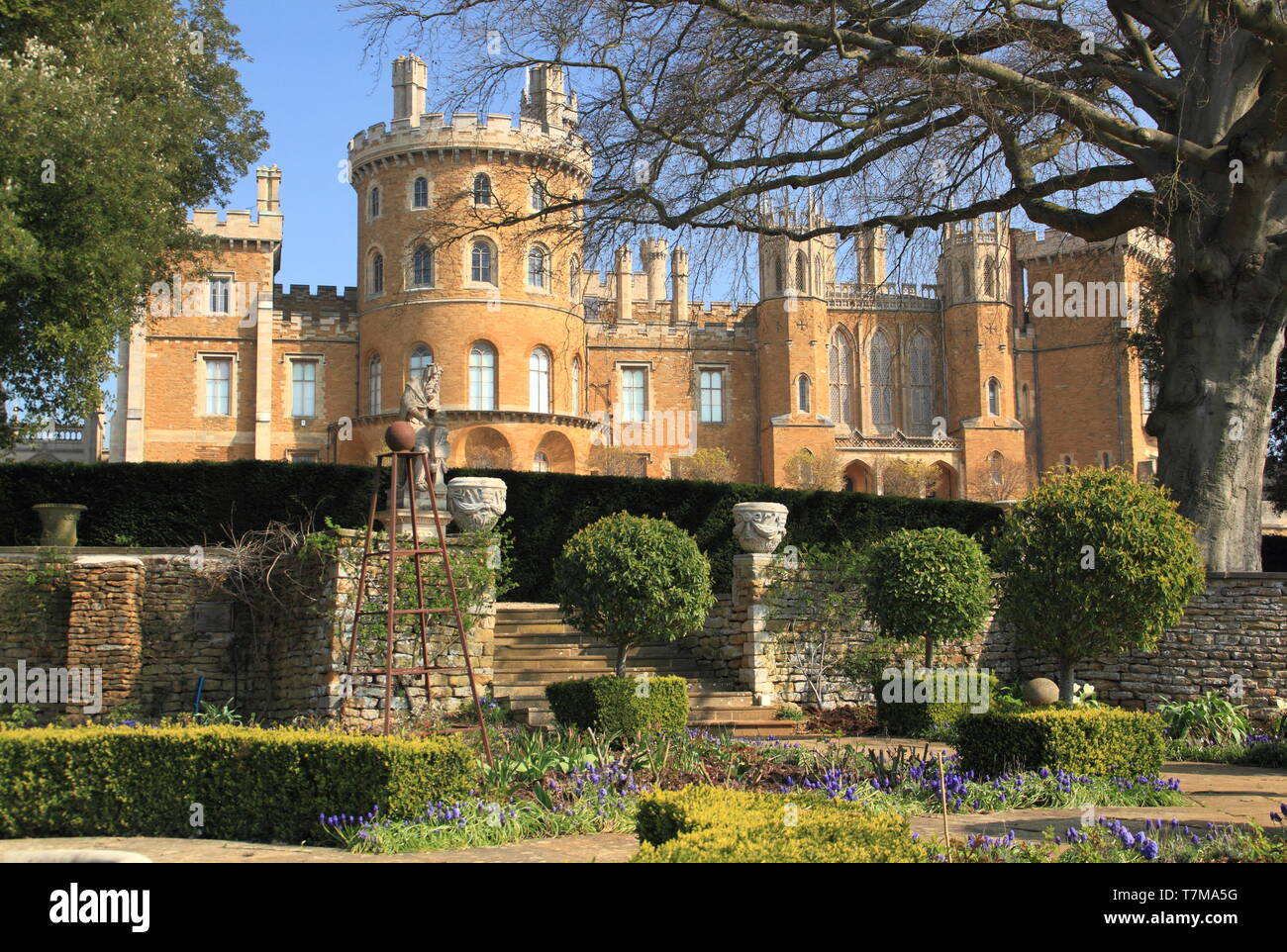 Belvoir Castle, an English stately home, seen from the formal rose garden in spring, Leicestershire, East Midlands, UK Stock Photo