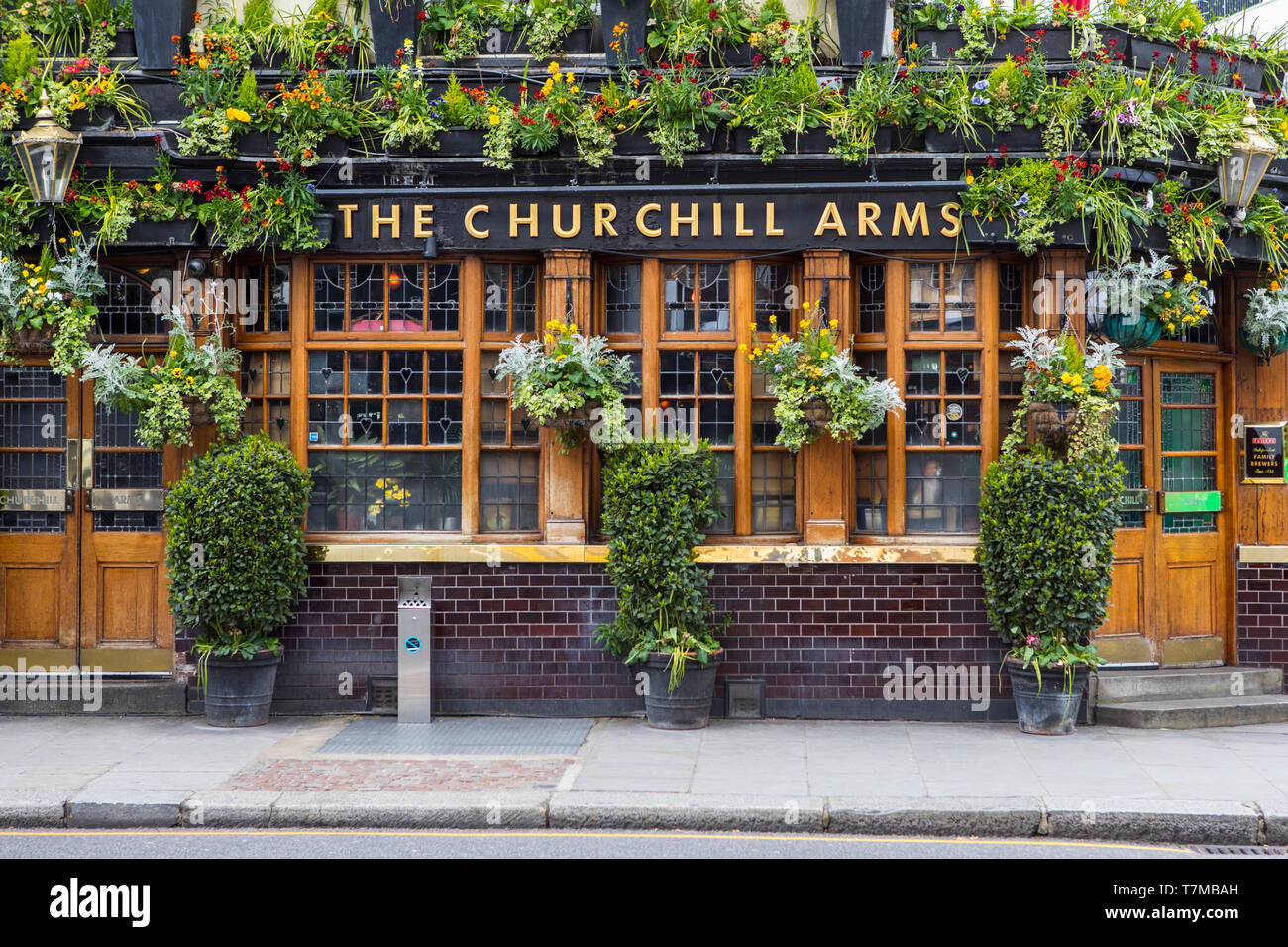 London, UK - May 2nd 2019: The Churchill Arms public house in Notting Hill, London, UK. It has often been described as the most colourful pub in Londo Stock Photo