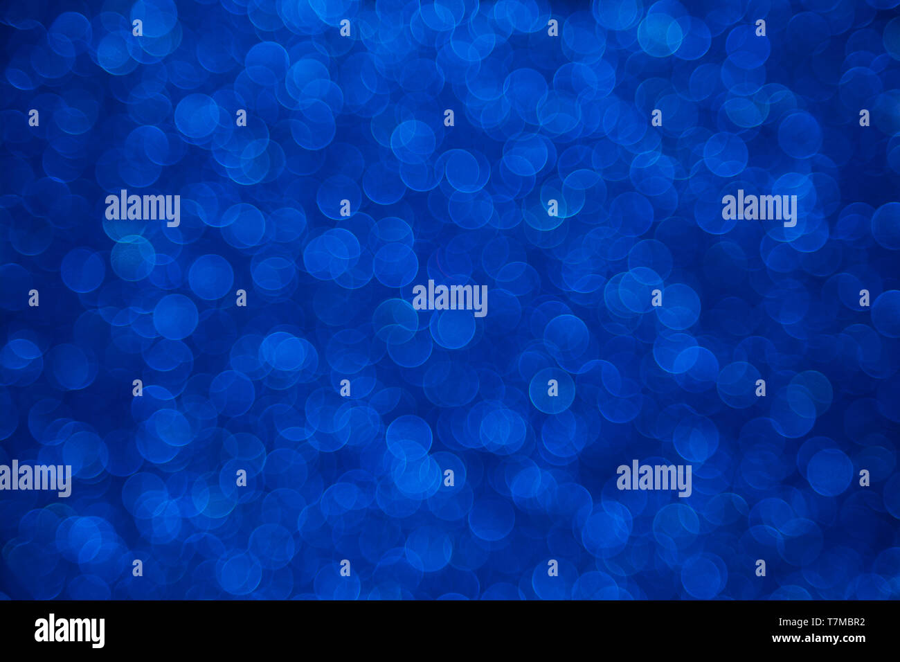 Dark blue bokeh defocused background Stock Photo