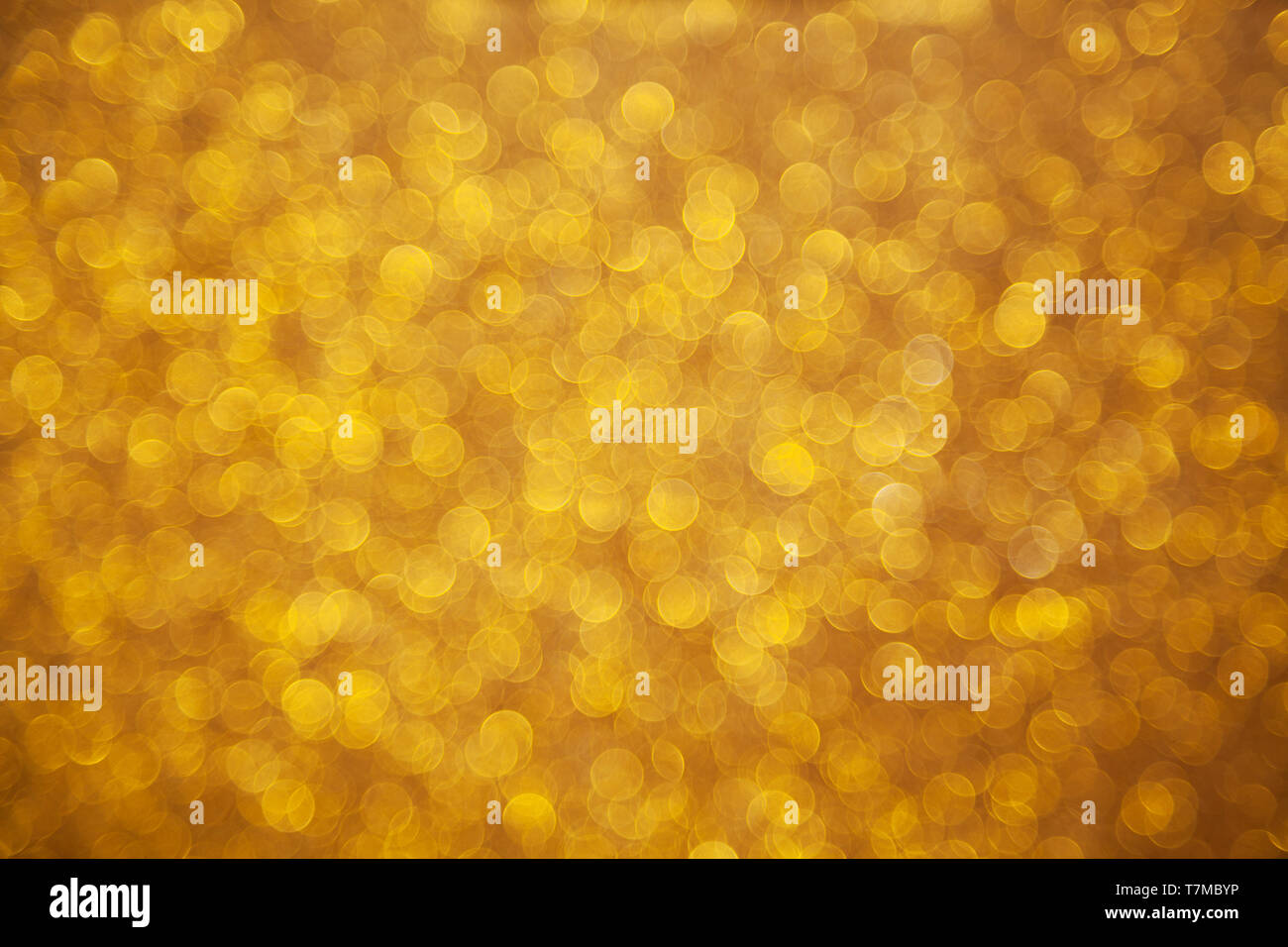 Golden bokeh defocused background Stock Photo