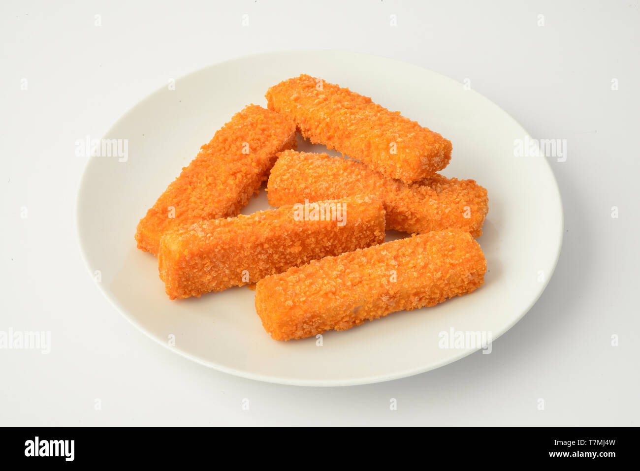 Fish Fingers, Fish Sticks on a white plate. Studio picture against
