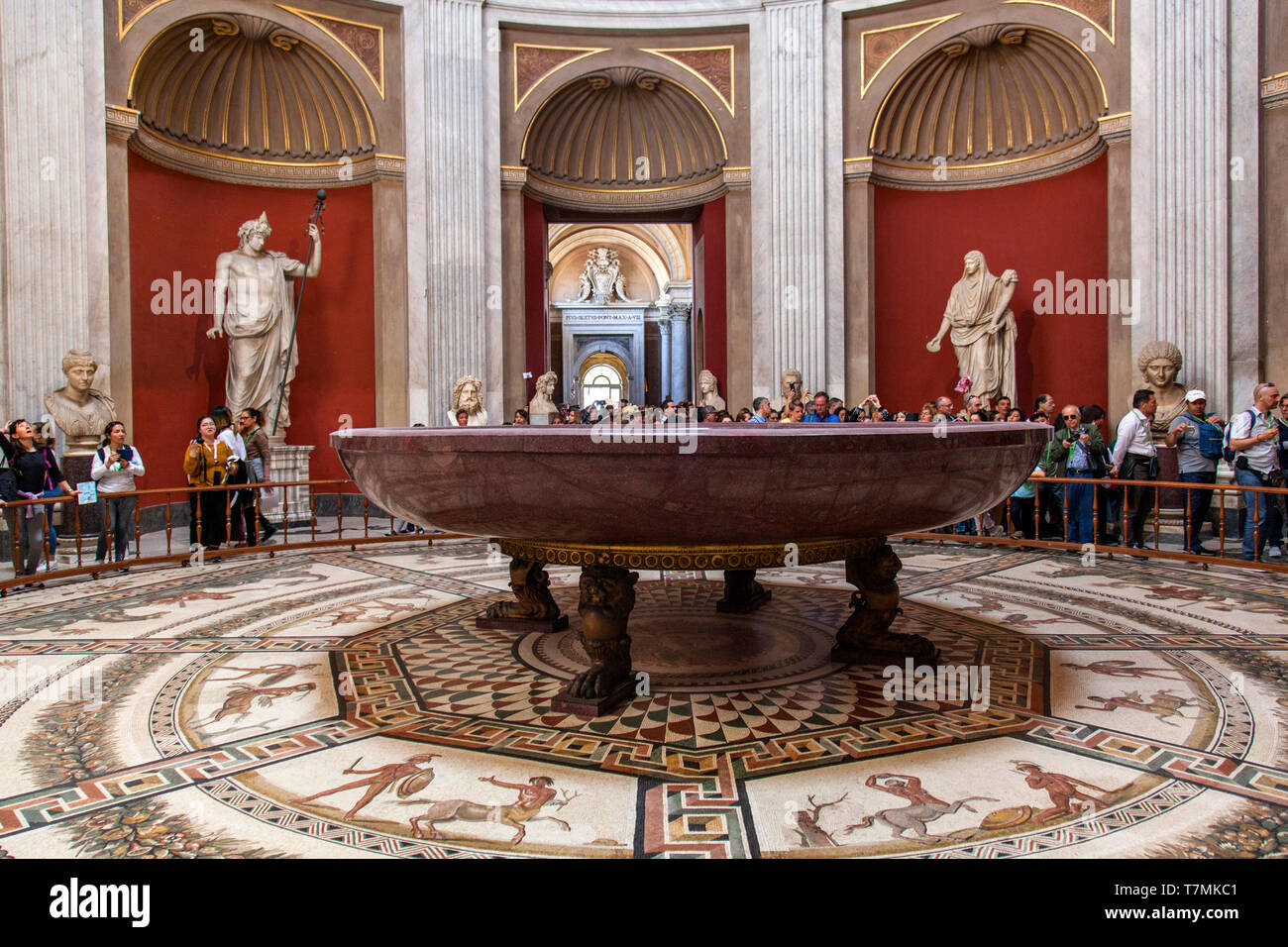 Hercules figures and round monolithic porphyry basin in Round Room in the Vatican Museum,Vatican City, Rome, Italy Stock Photo