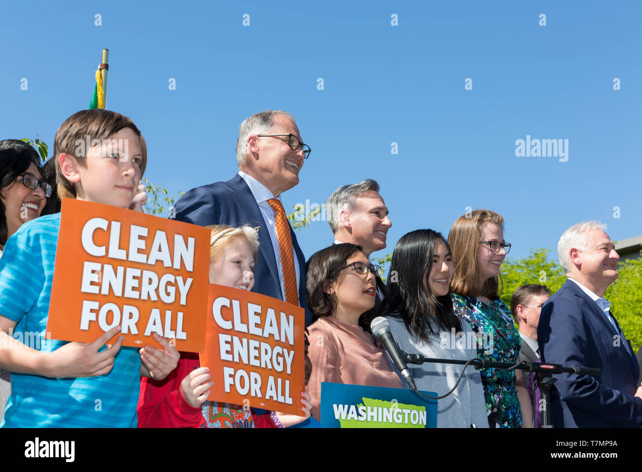 Seattle, USA. 7th May, 2019. Governor and 2020 presidential candidate Jay Inslee poses with supporters, state and local legislators after signing the nation’s strongest clean energy bill at Neighborhood House in the Rainier Vista neighborhood. The legislation, introduced by the governor in December, includes a 100 percent clean energy bill, a first-in-the-nation clean buildings policy, a reduction of greenhouse gas emissions, and incentives to electrify transportation. Inslee has centered his presidential campaign around climate change and environmental issues. Credit: Paul Christian Gordon/Al Stock Photo